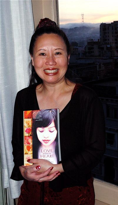 Teresa LeYung Ryan holding her book