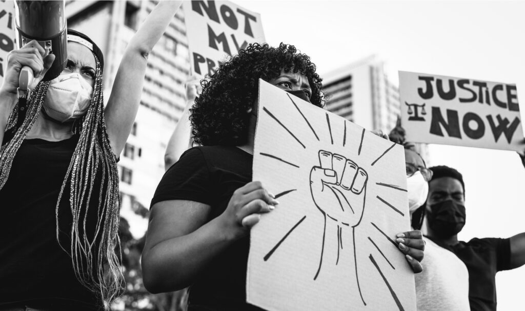 Black lives matter international activist movement protesting against racism and fighting for justice - Demonstrators from different cultures and race protest on street for equal rights